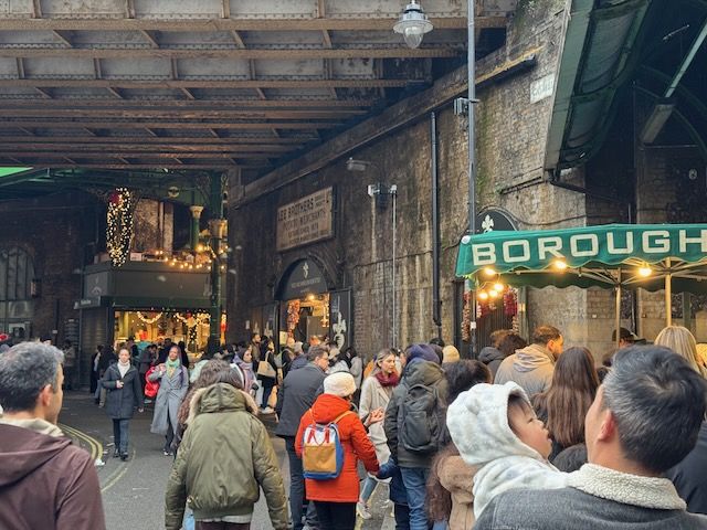 A busy Borough Market on Christmas Eve.