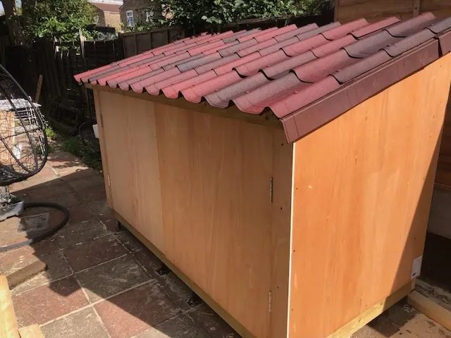 The completed workbench with the front panels open, revealing the workspace inside.