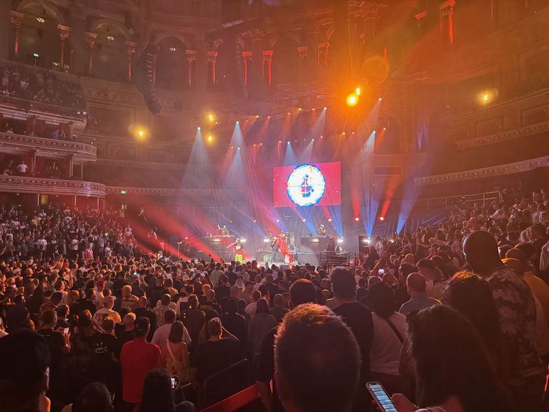 Wide shot of the hall with the band on stage