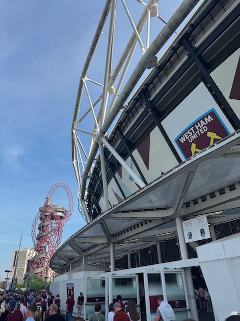 The outside of the London Stadium with the ArcelorMittal Orbit in the background