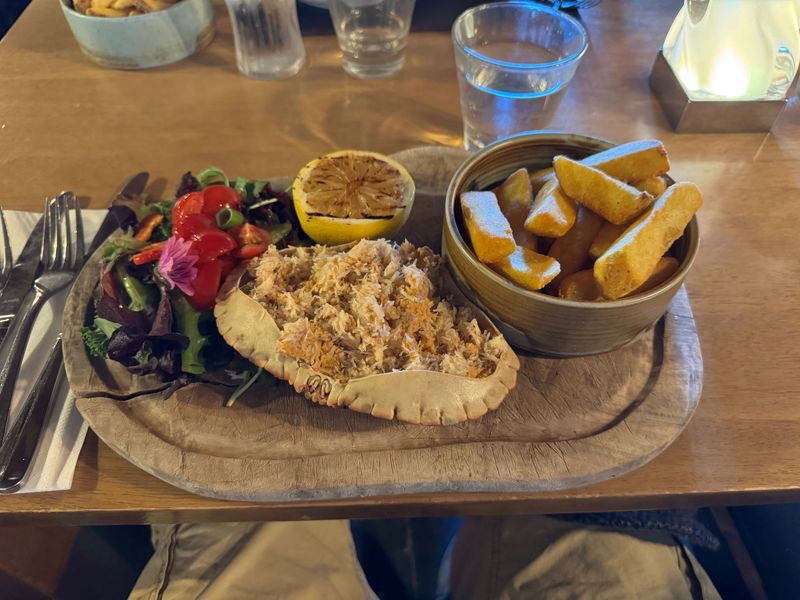 Stuffed crab with chips and salad