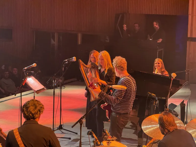Glen singing a song with The Web Sisters. One is playing a small harp