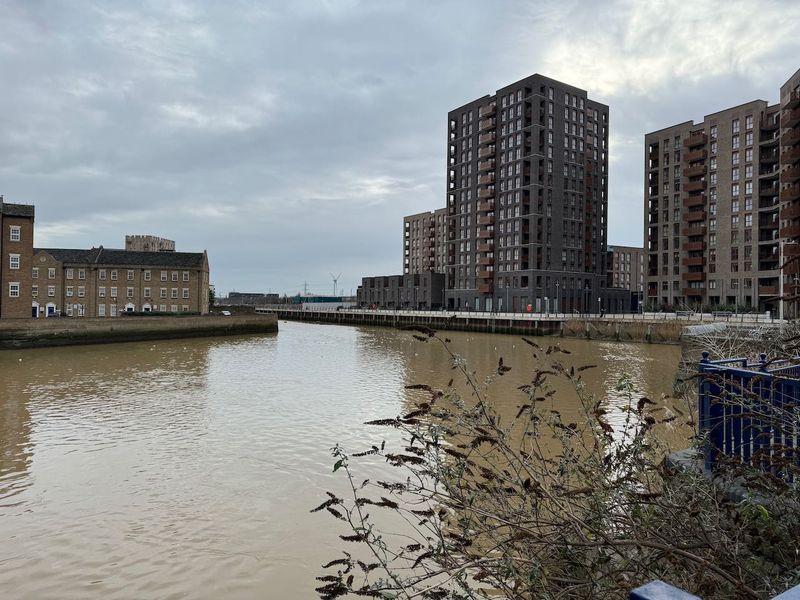 Small water inlet with apartment buildings on both sides